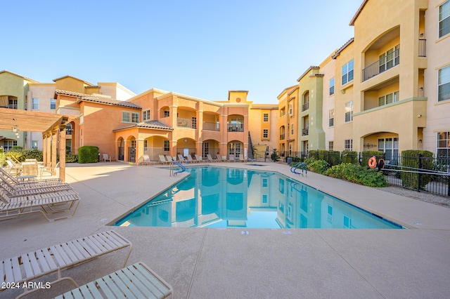 view of pool featuring a patio area