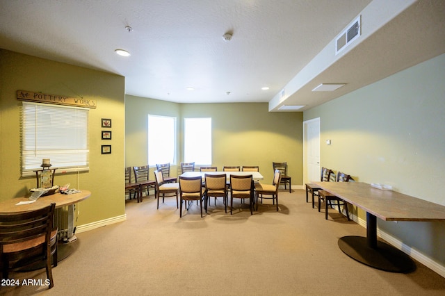 dining space featuring carpet flooring