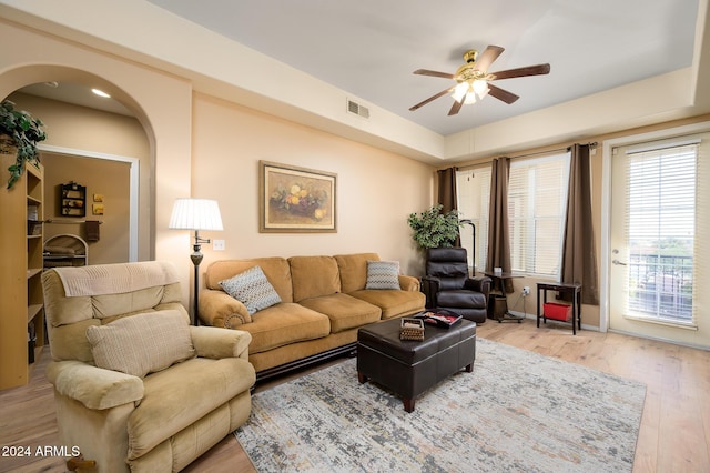 living room featuring light wood-type flooring and ceiling fan