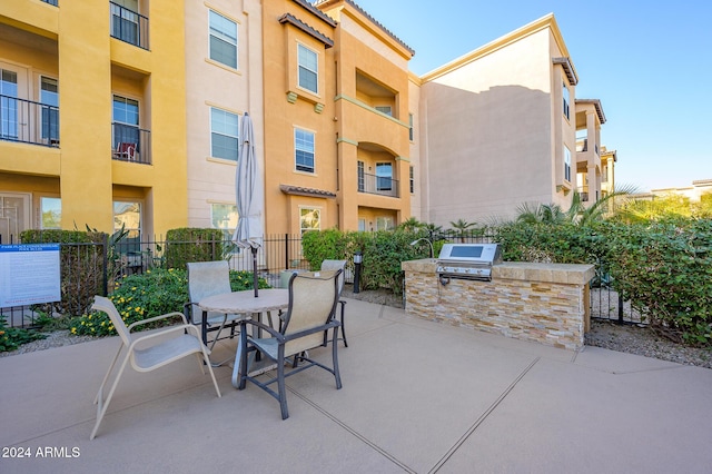 view of patio featuring area for grilling and exterior kitchen