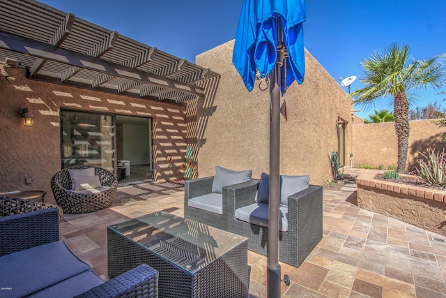 view of patio / terrace featuring a pergola and outdoor lounge area