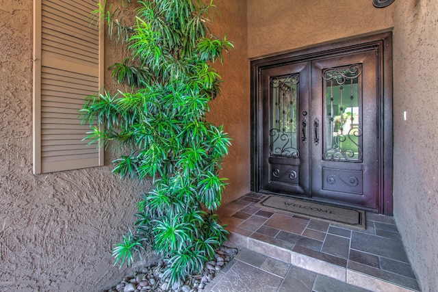 entrance to property featuring french doors