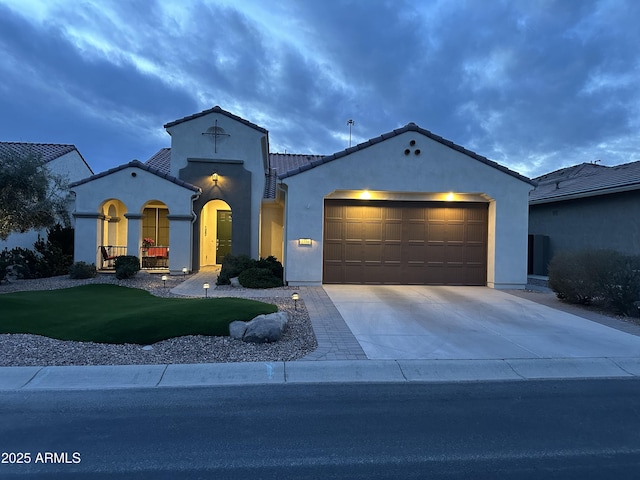 view of front of home featuring a garage and a front yard