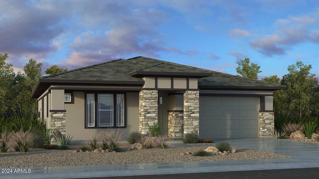 prairie-style house featuring a garage