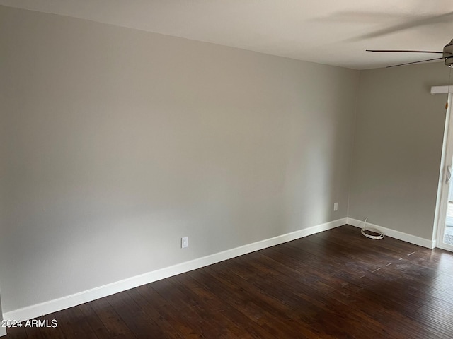 unfurnished room featuring dark hardwood / wood-style floors and ceiling fan