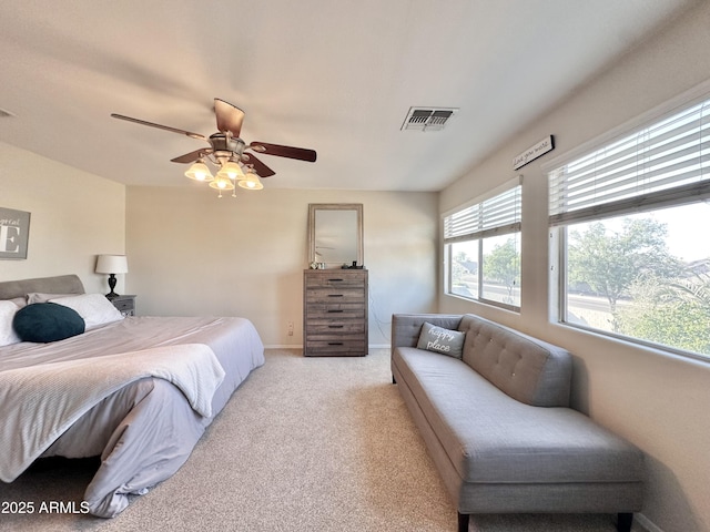 bedroom featuring visible vents, ceiling fan, carpet floors, and baseboards
