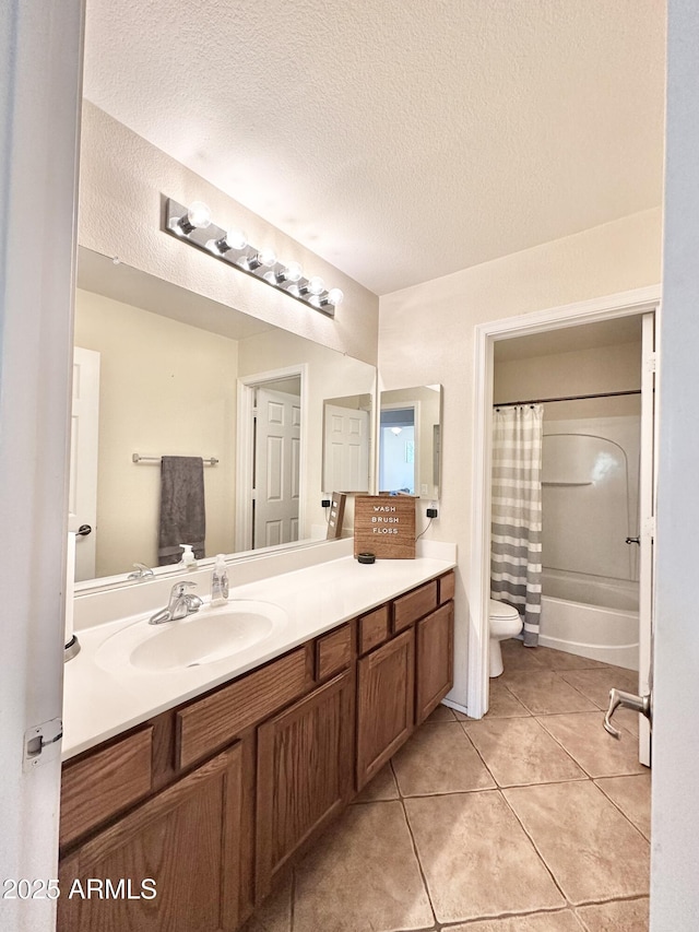 bathroom featuring shower / bath combo, vanity, tile patterned floors, toilet, and a textured ceiling
