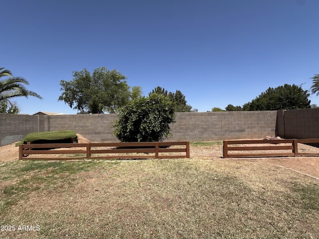 view of yard with a fenced backyard