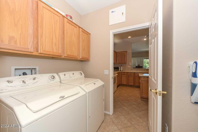 17041 W Artesia Dr, Surprise, AZ 85387 - laundry room featuring cabinet space, light tile patterned floors, and washing machine and clothes dryer