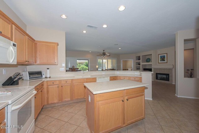 17041 W Artesia Dr, Surprise, AZ 85387 - kitchen with a sink, white appliances, a ceiling fan, light tile patterned floors, and visible vents