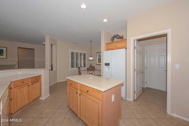 kitchen featuring a center island, decorative light fixtures, light tile patterned flooring, and white fridge with ice dispenser