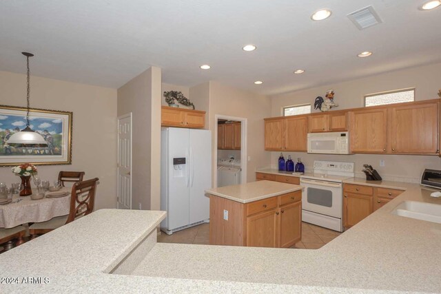 17041 W Artesia Dr, Surprise, AZ 85387 - kitchen featuring visible vents, a sink, light tile patterned floors, separate washer and dryer, and white appliances
