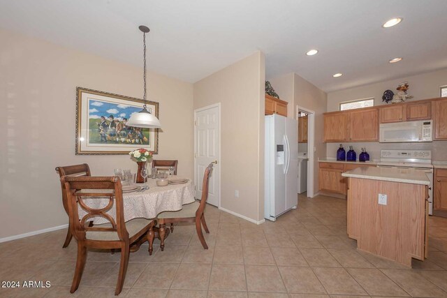 17041 W Artesia Dr, Surprise, AZ 85387 - kitchen with white appliances, baseboards, a center island, and light countertops