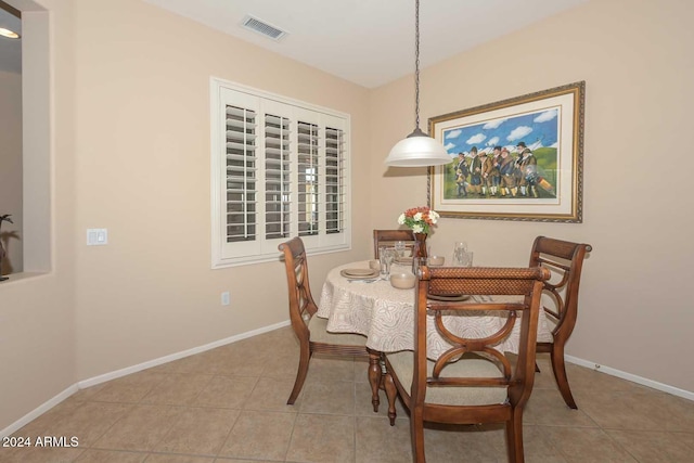 dining space with light tile patterned flooring