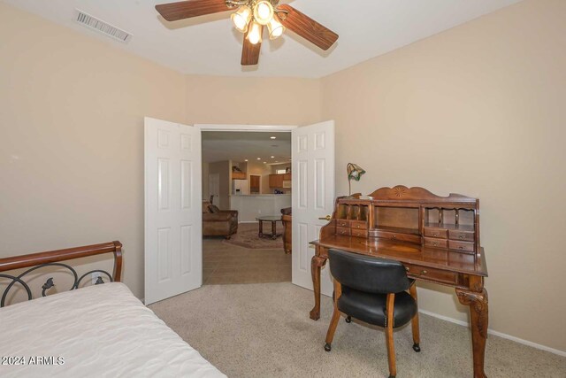 17041 W Artesia Dr, Surprise, AZ 85387 - bedroom with carpet flooring, white refrigerator with ice dispenser, a ceiling fan, baseboards, and visible vents