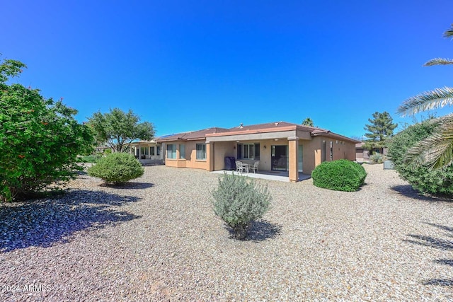 back of property featuring a patio