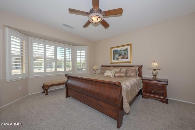 bedroom with light colored carpet and ceiling fan