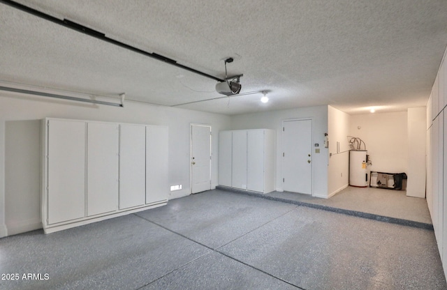 garage with electric water heater and a garage door opener