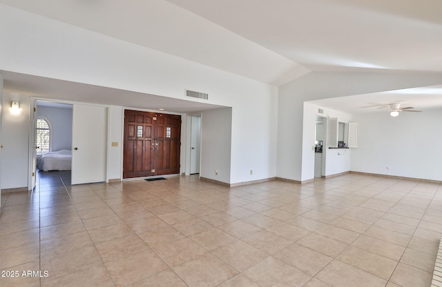 unfurnished living room featuring light tile patterned flooring, visible vents, baseboards, vaulted ceiling, and a ceiling fan