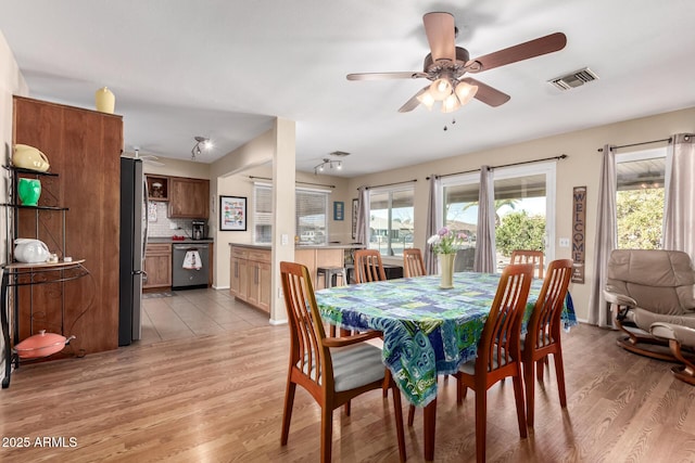 dining area featuring light hardwood / wood-style floors and ceiling fan