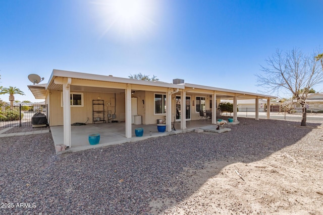 back of property with a patio area