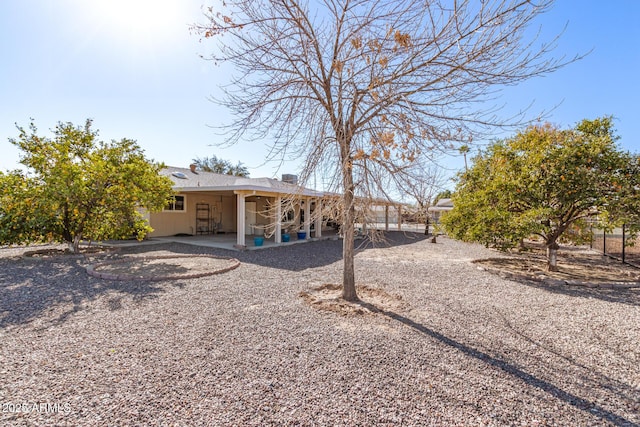 rear view of house with a patio