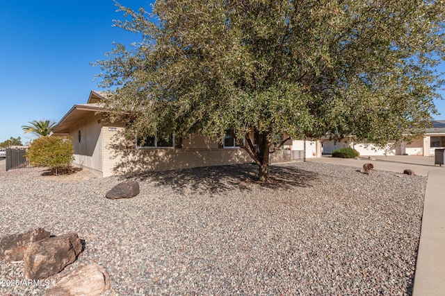 view of property hidden behind natural elements