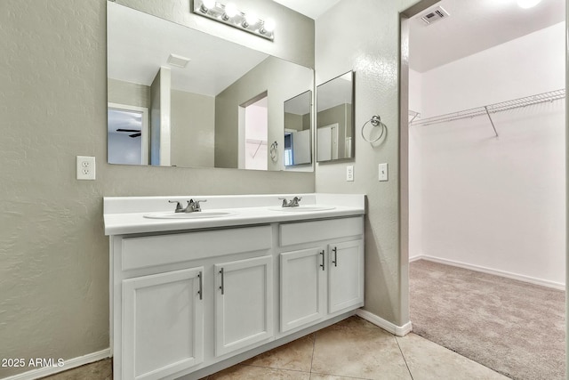 bathroom featuring vanity and tile patterned flooring