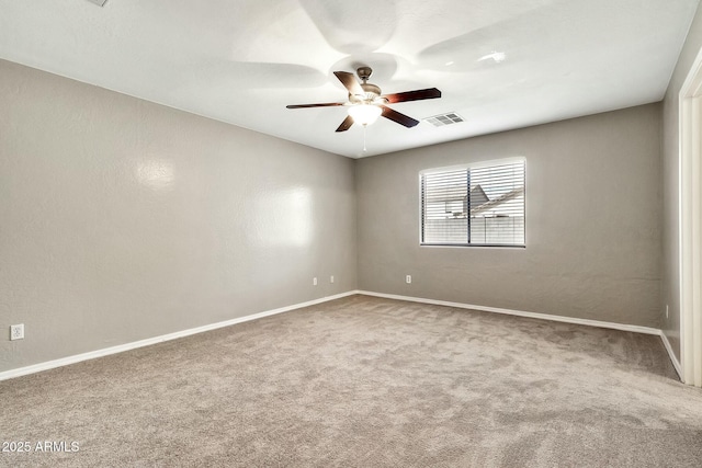 carpeted empty room with ceiling fan