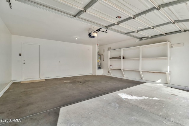 garage with a garage door opener and water heater