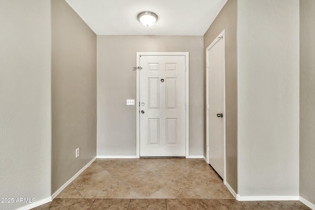 view of tiled foyer entrance