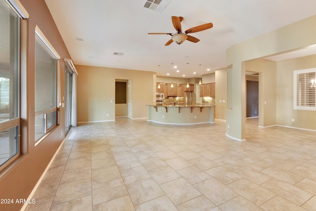 unfurnished living room featuring recessed lighting, light tile patterned flooring, baseboards, and visible vents