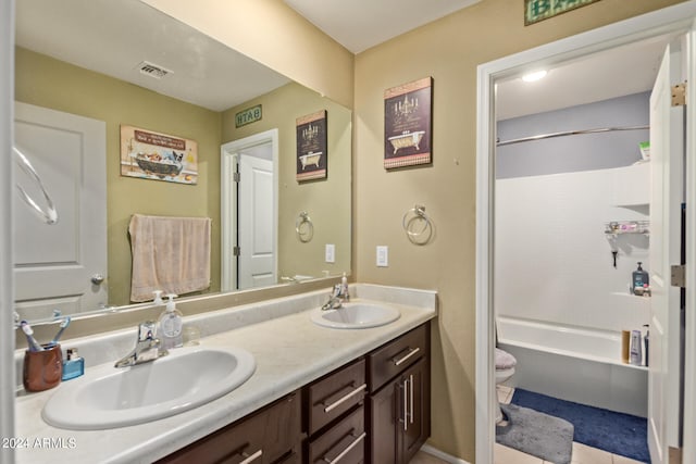 full bathroom featuring dual vanity, tile patterned floors, tub / shower combination, and toilet