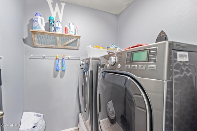 laundry area with separate washer and dryer