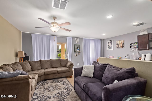 living room featuring ceiling fan