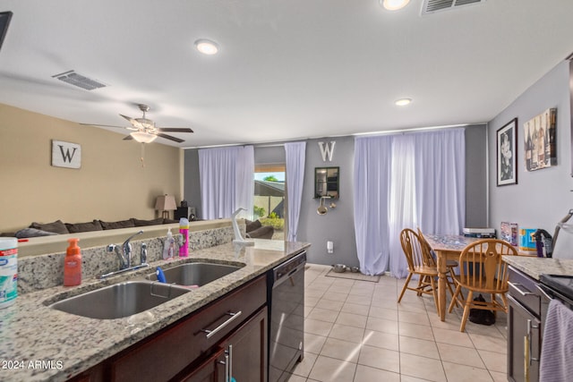 kitchen featuring sink, light stone counters, light tile patterned floors, dishwasher, and ceiling fan