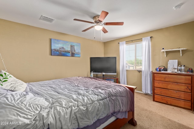 bedroom with ceiling fan and light colored carpet