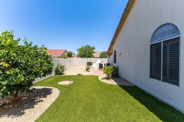 view of yard with a patio and a fenced backyard