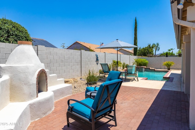 view of patio / terrace with a fenced backyard and a fenced in pool