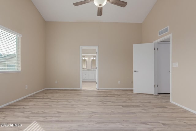 empty room with visible vents, baseboards, a ceiling fan, and light wood finished floors