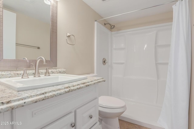 bathroom with vanity, a shower with shower curtain, toilet, and tile patterned floors