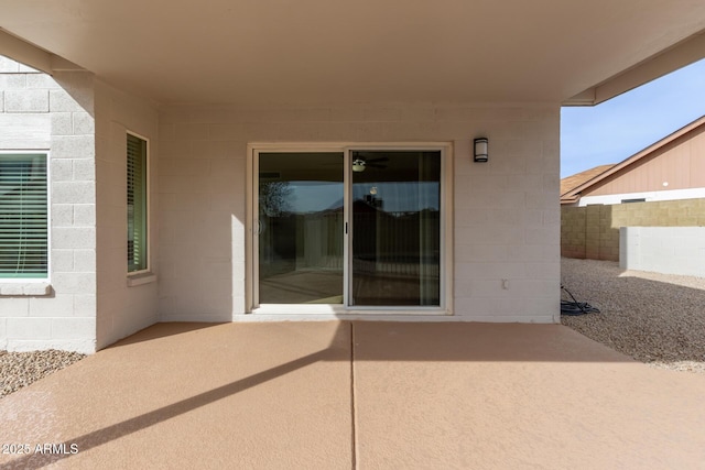 view of patio / terrace featuring fence