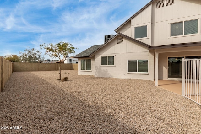 rear view of property with a patio area and a fenced backyard