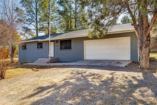 ranch-style home featuring a garage