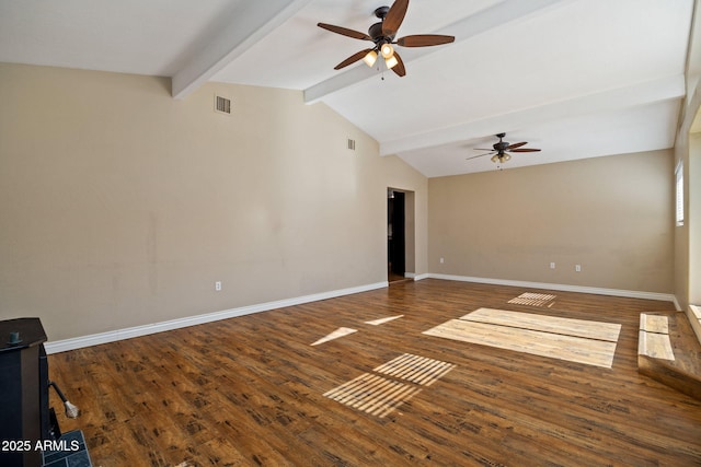 spare room featuring ceiling fan, dark hardwood / wood-style flooring, and vaulted ceiling with beams