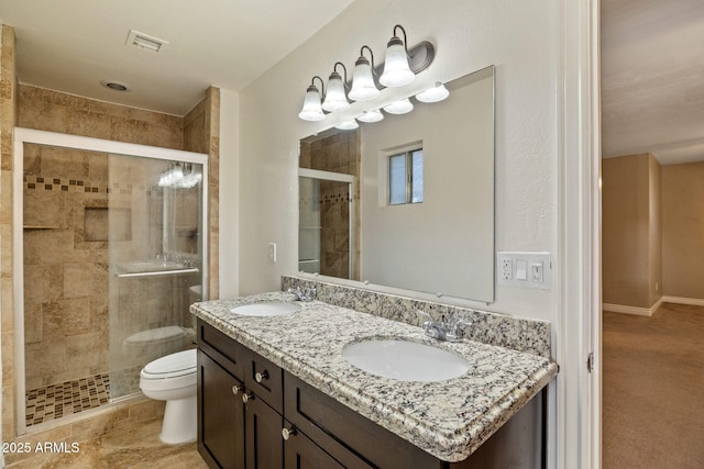 bathroom featuring walk in shower, vanity, and toilet