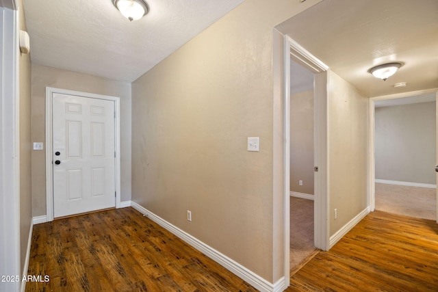 hallway featuring dark hardwood / wood-style floors