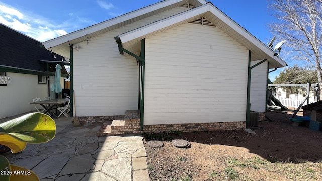 view of property exterior featuring a patio area