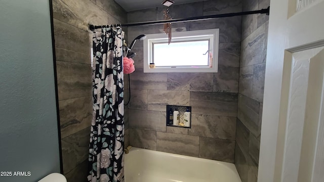 bathroom with shower / bathtub combination with curtain