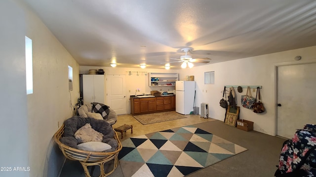 interior space featuring sink and ceiling fan